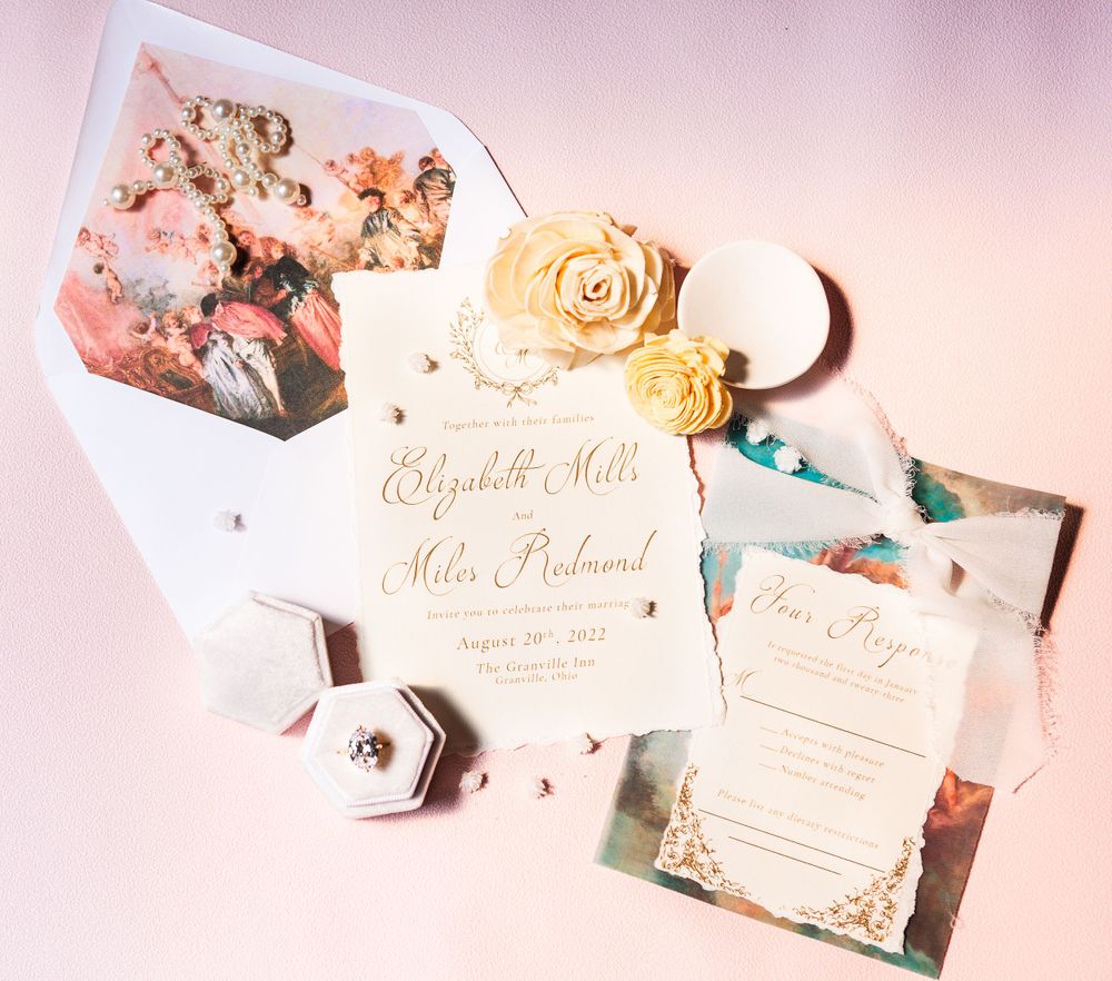 Close-up of an elegant wedding invitation suite and bridal jewelry, showcasing custom designs for a timeless wedding