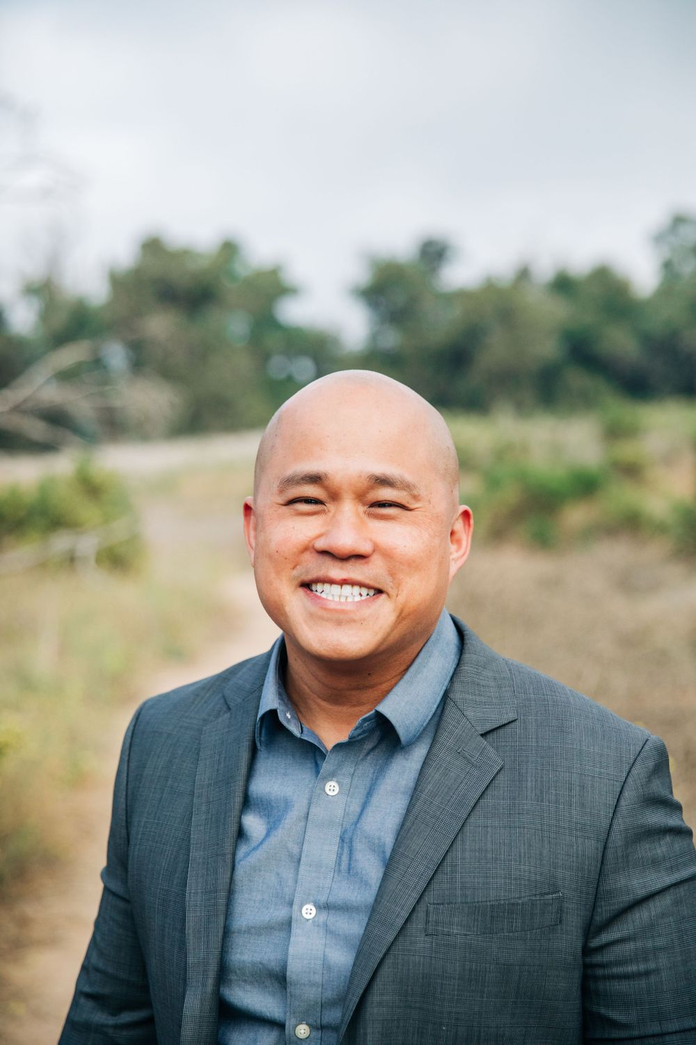 Professional headshots showing warm expressions in business attire.
