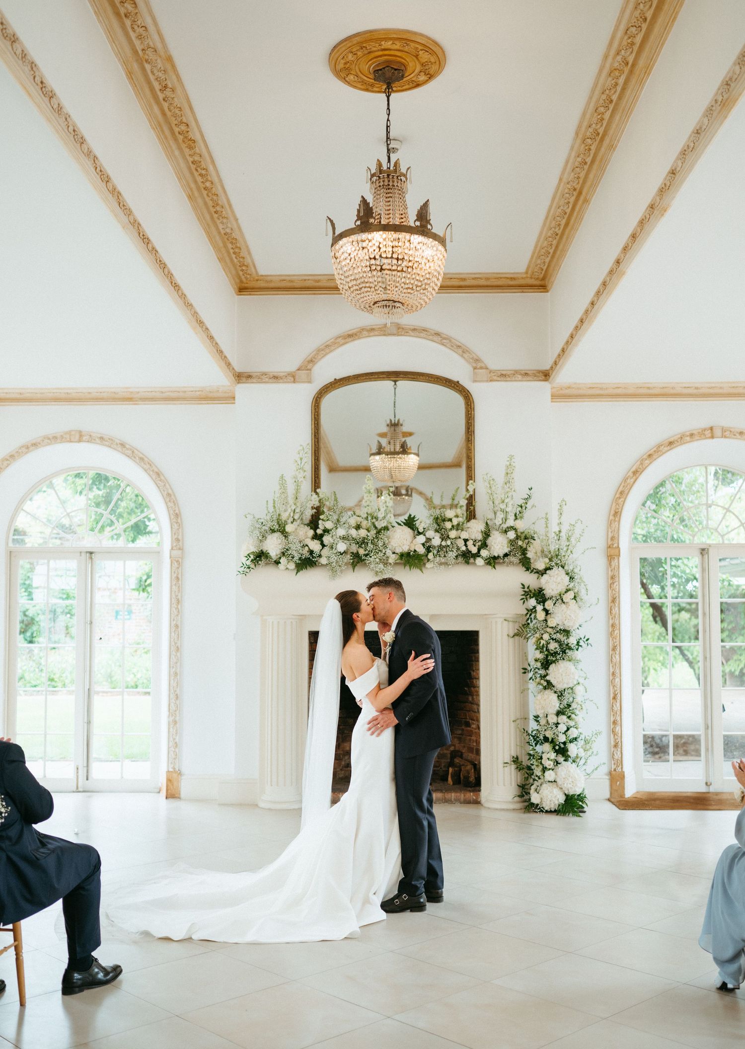 Couple kissing at the alter, at Northbrook park Hampshire
