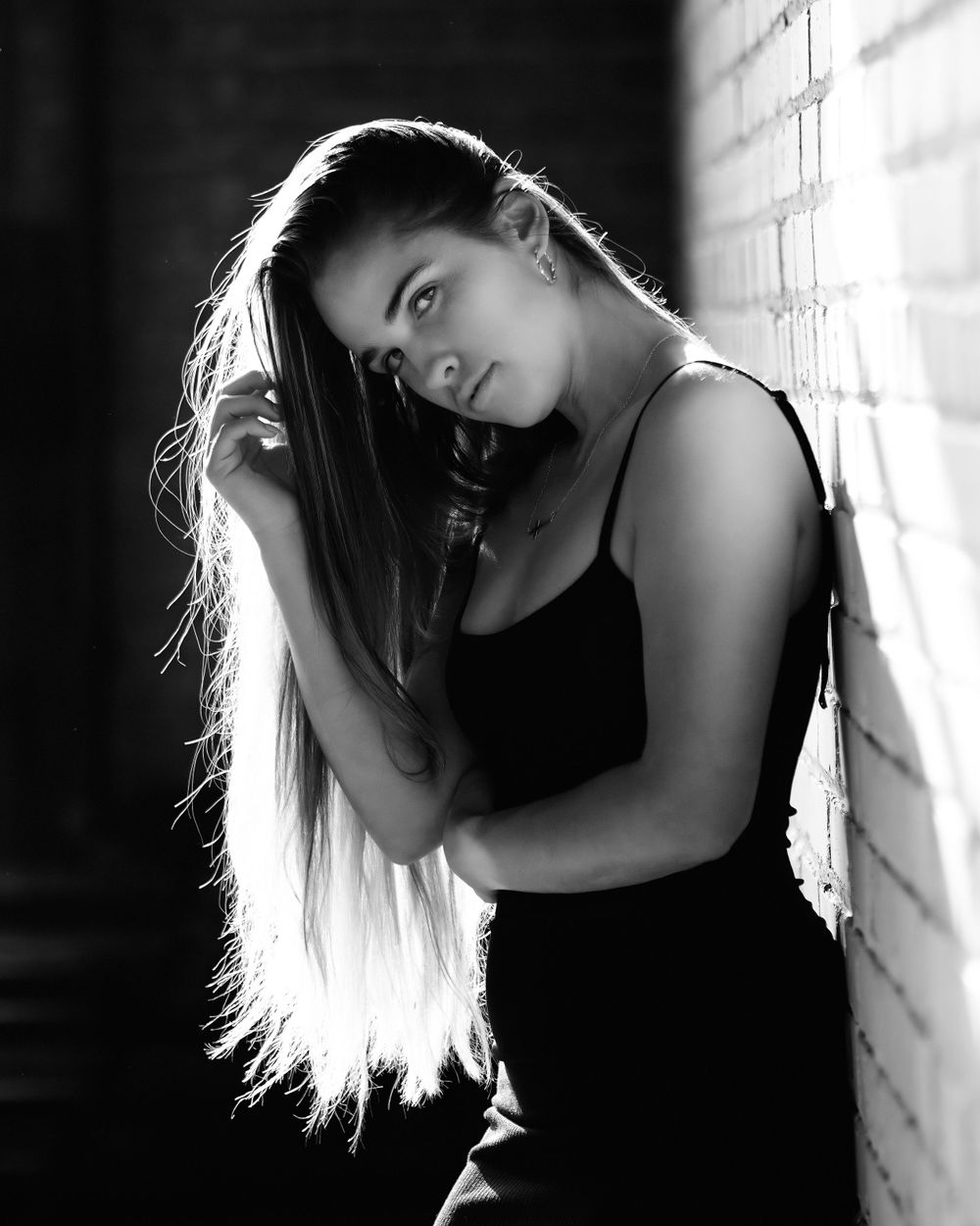 David G Holt Photography - Dramatic black and white portraits showing silhouetted figure against window light.
