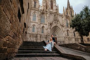 Couple walking hand in hand through Barcelona Old City