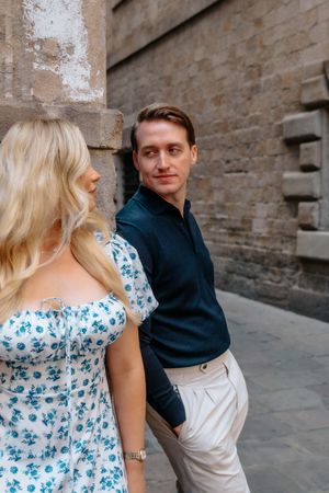 Romantic couple holding hands in Old City Barcelona