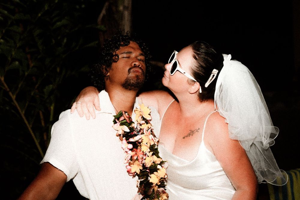 A wedding couple sharing an intimate moment during their reception.