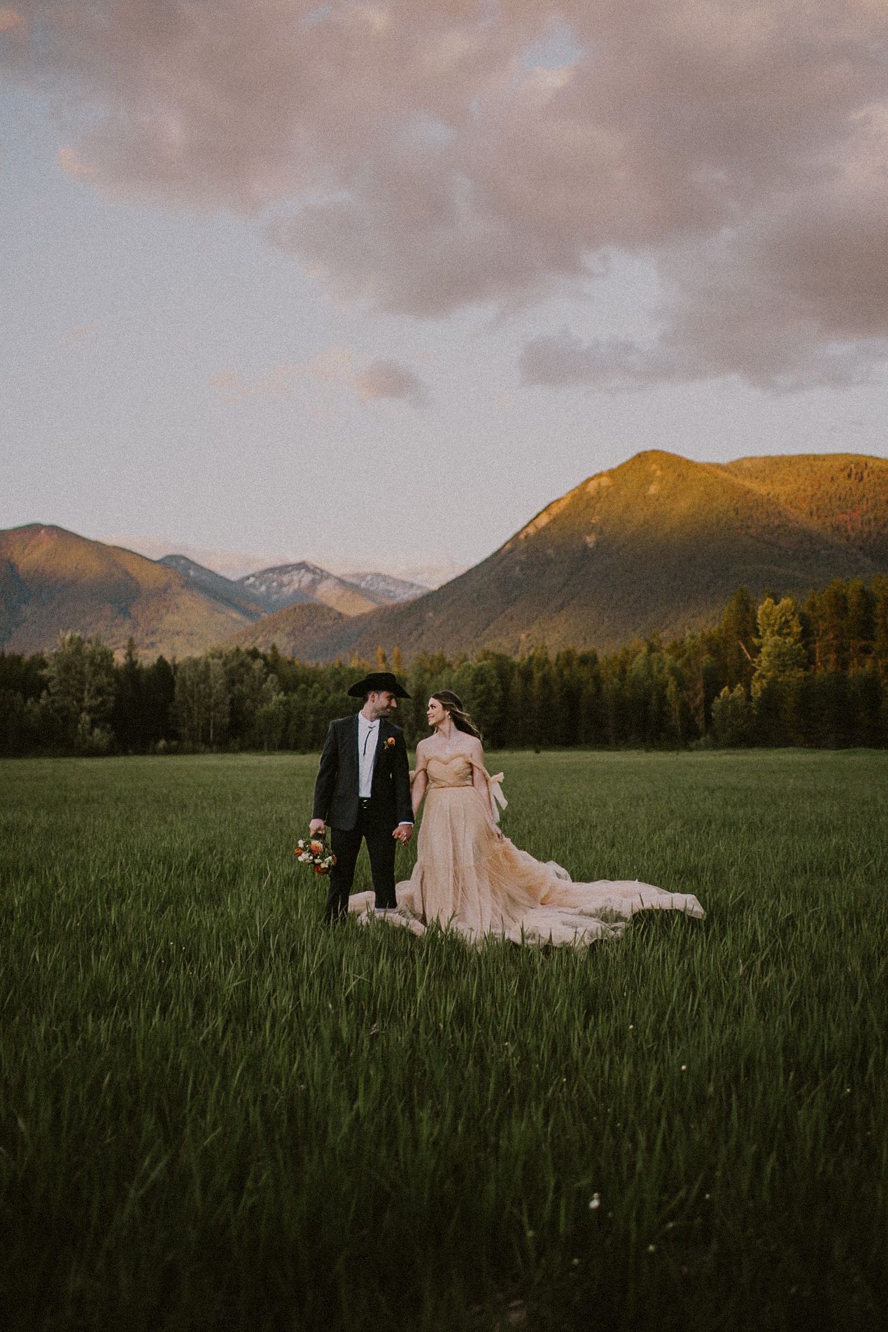 couple in wedding attire, man in cowboy hat, western theme, Colorado wedding & Elopement