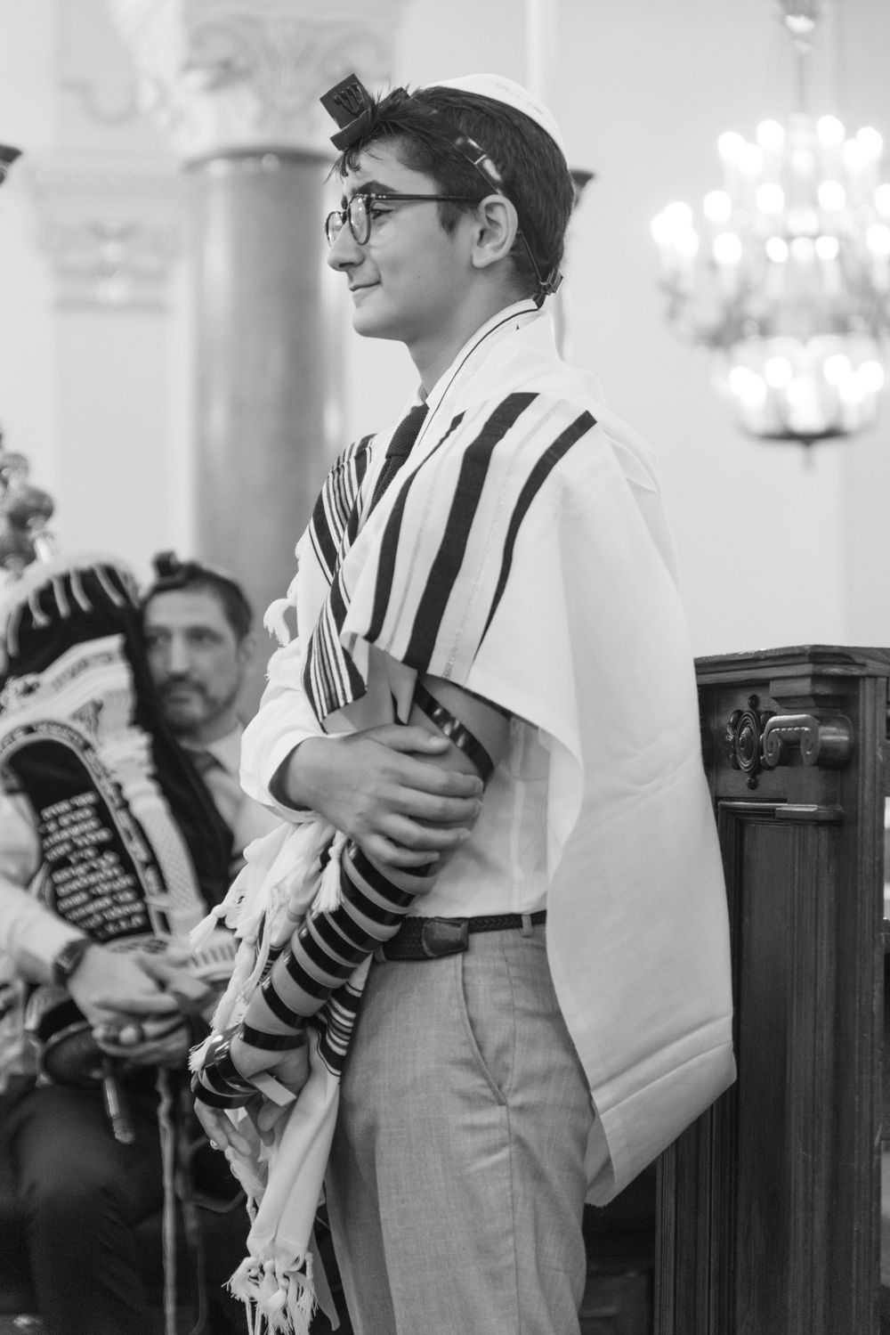 Traditional religious ceremony attire with prayer shawl and cap in black and white.bar mitsva