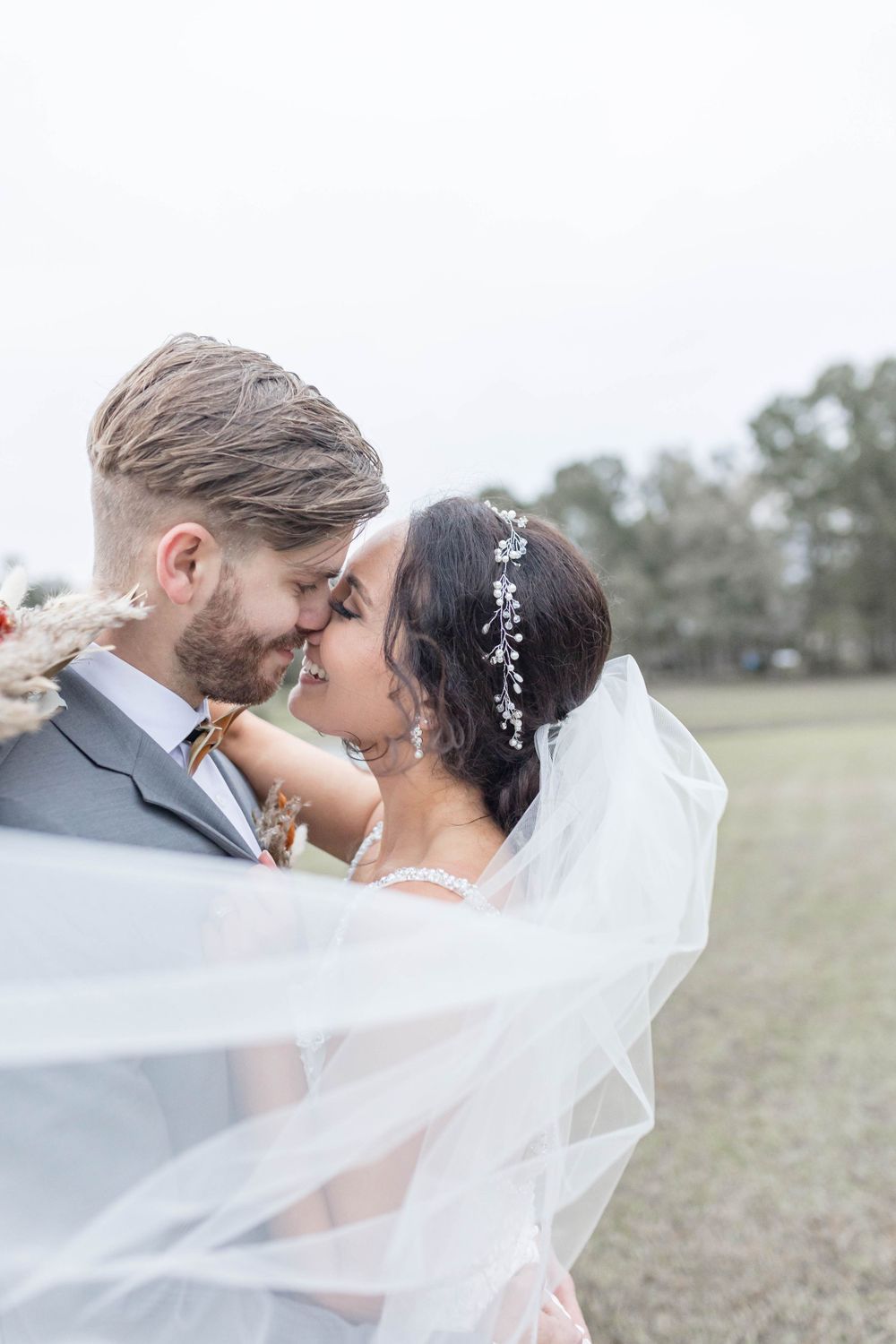 bride and groom kiss