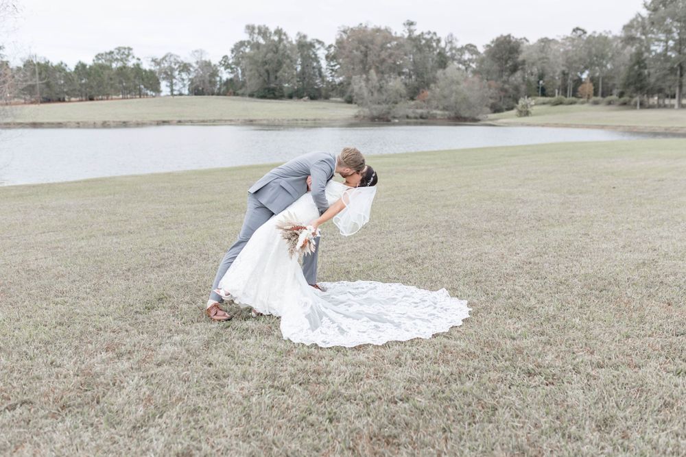 groom dips bride and kisses her
