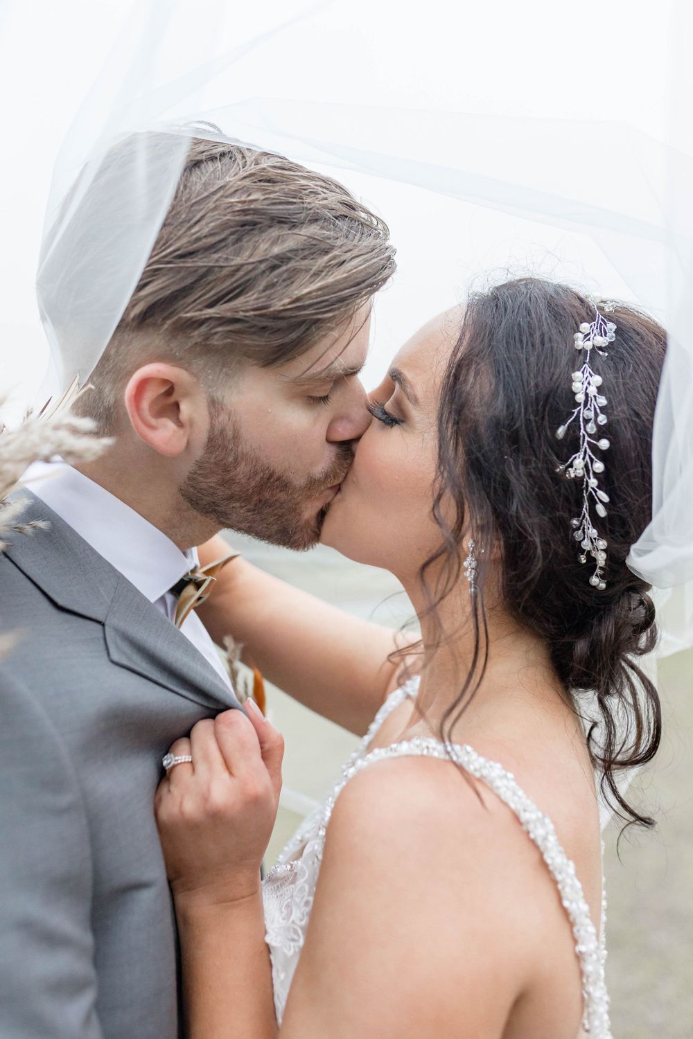 bride and groom kiss