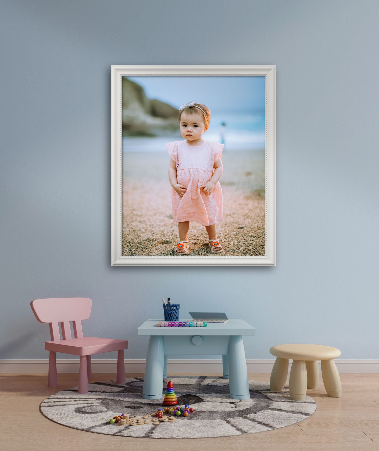 Framed photograph of a todler girl in a children's room.