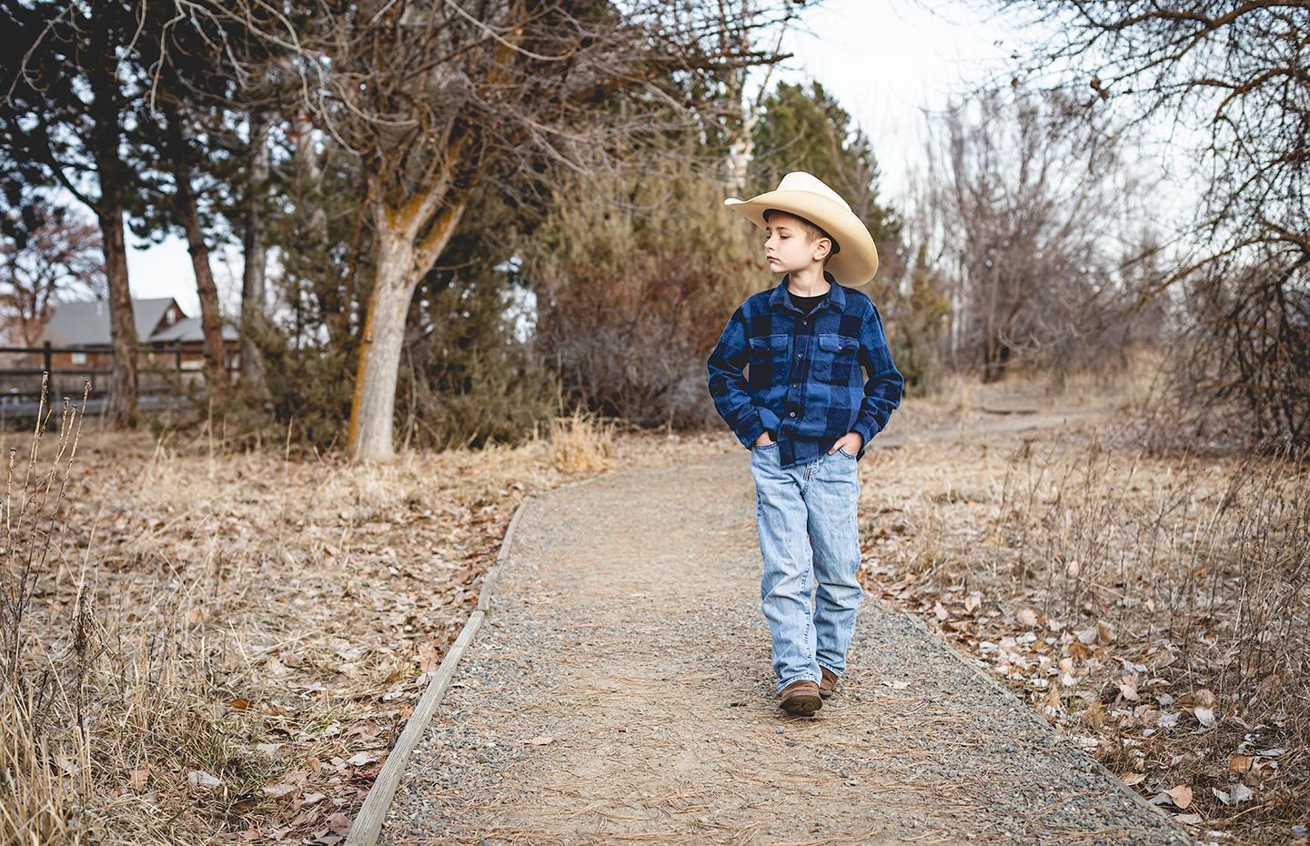 young boy walking down a path at the paul rogers wildlife park in ellensburg, wa