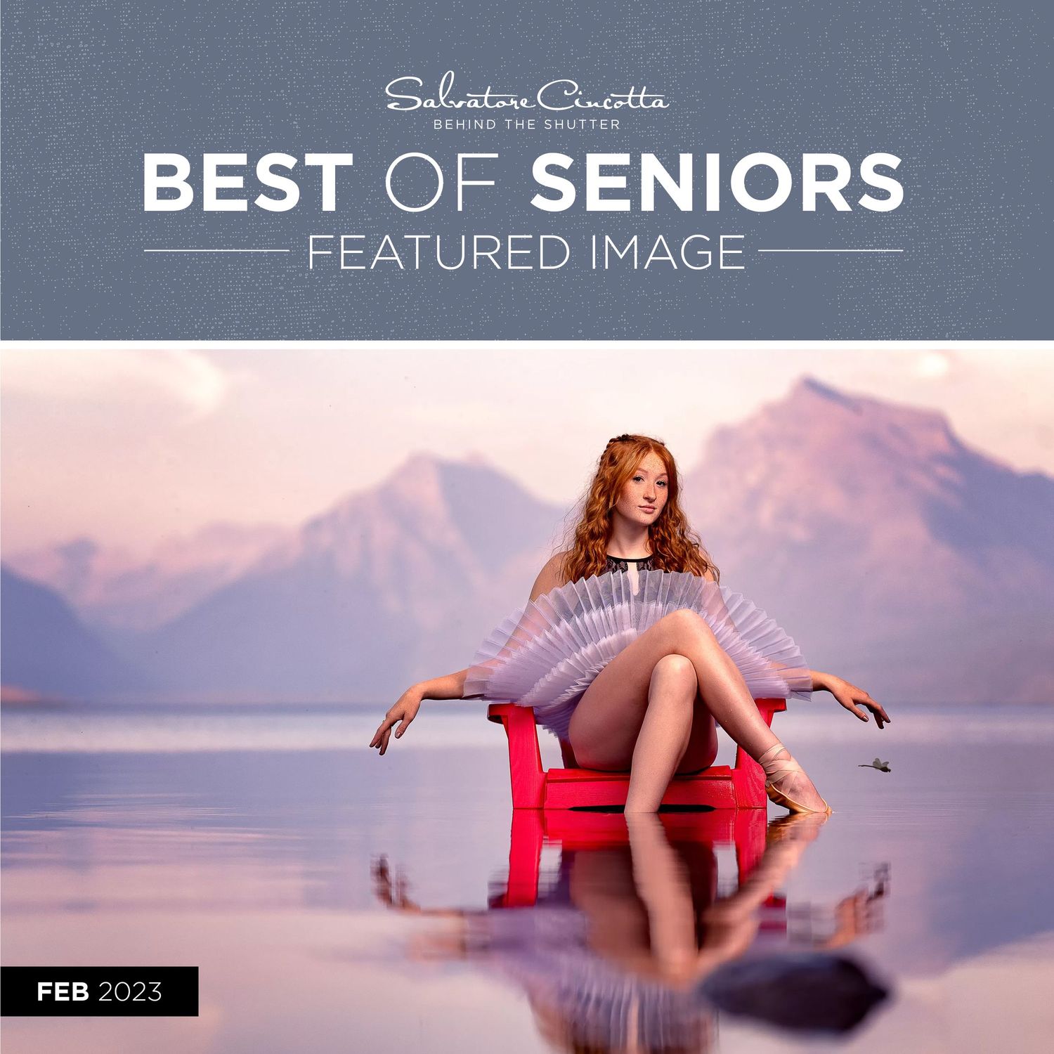 Artistic senior portrait featuring a figure in a red chair reflected in water with mountains at sunset.
