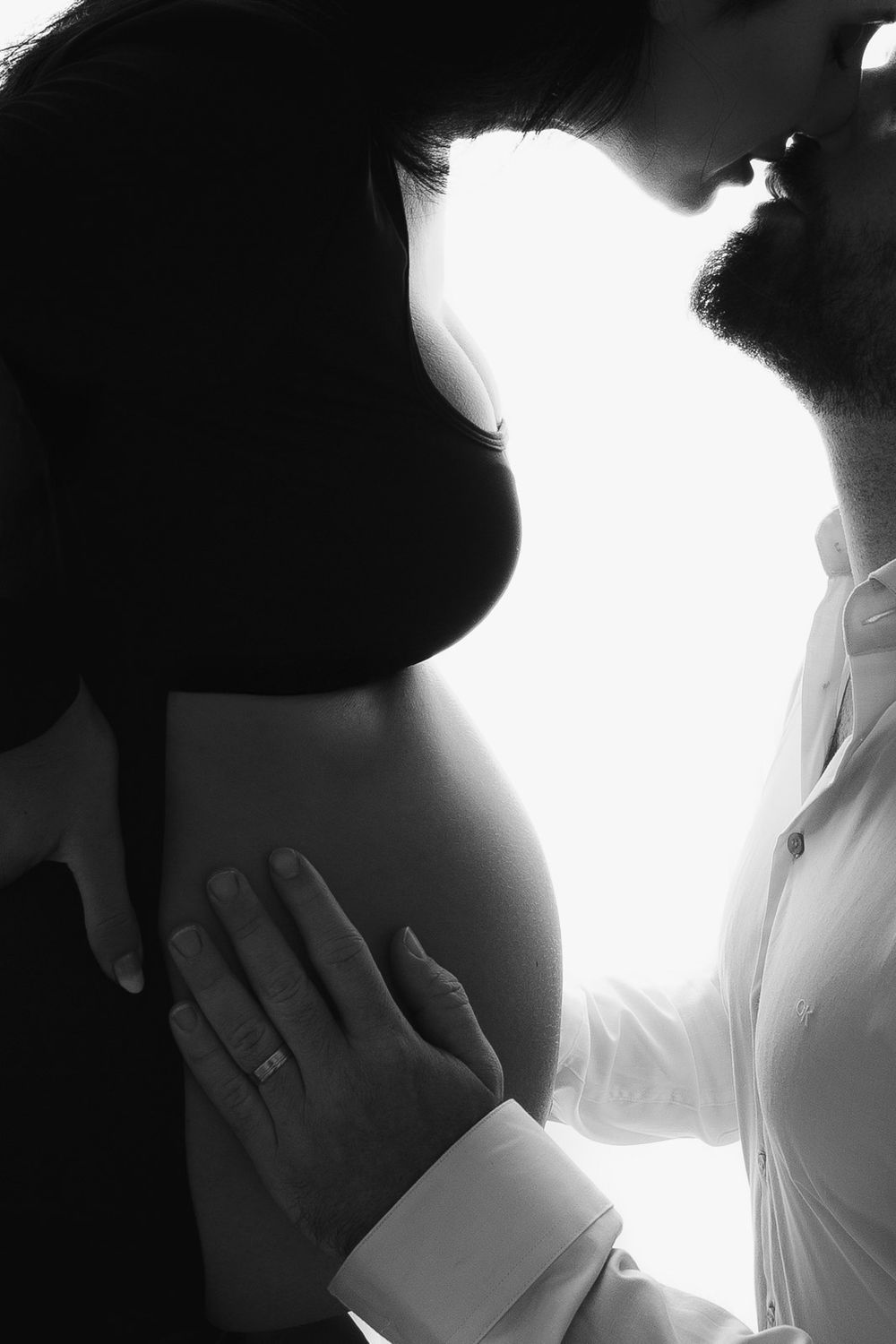 A series of black and white photographs showing hands and silhouettes in an artistic composition.