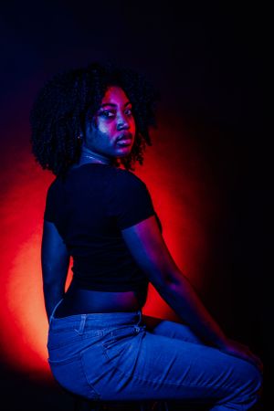Moody portrait sequence showing expressive movement with red and blue lighting contrast.