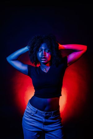 Creative photography series with dramatic lighting and emotive poses in dark setting.