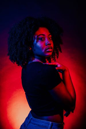 Artistic photo series featuring dramatic shadows and vivid red and blue lighting effects.