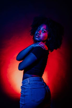 Atmospheric portrait collection with bold lighting and expressive body language.