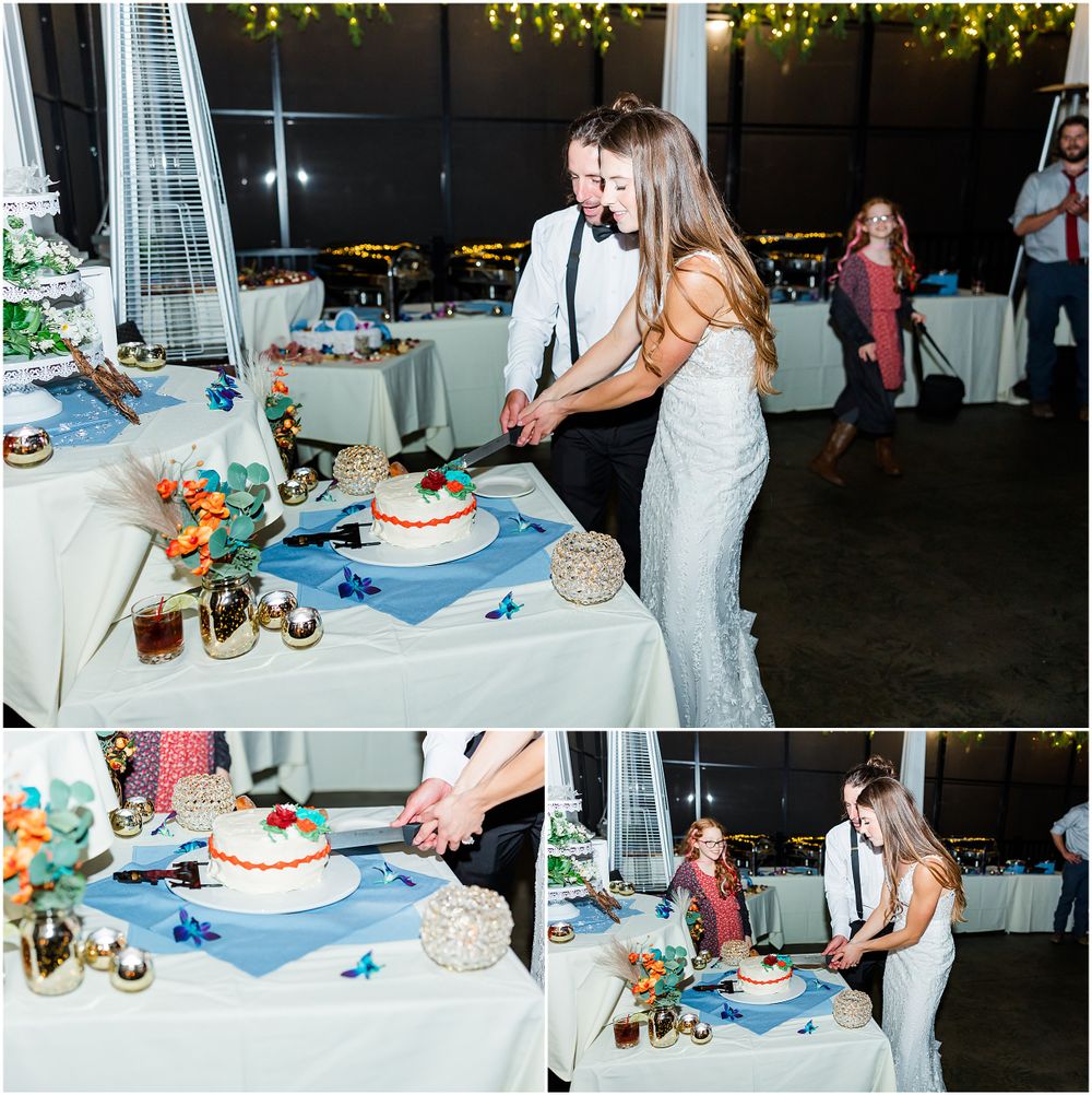 Couple cutting their multi-tiered wedding cake at the reception dessert table.