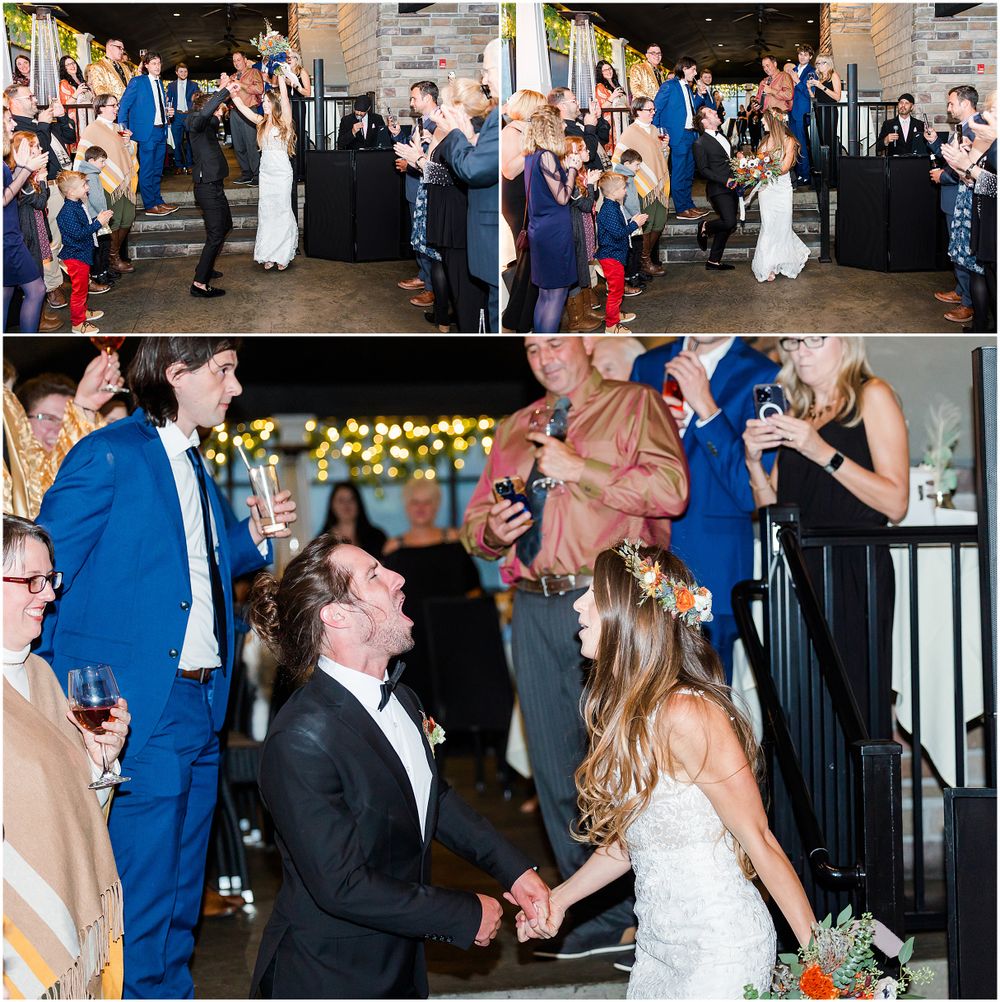 Wedding party celebrating during reception with crowd cheering and applauding.