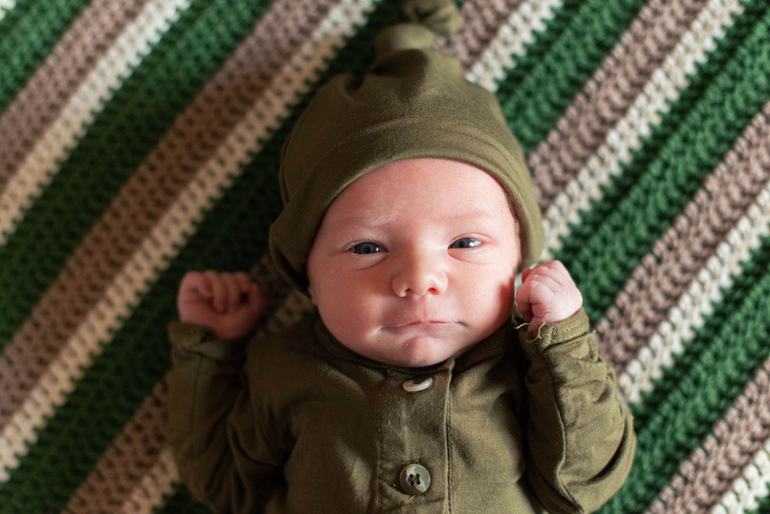 In-home lifestyle newborn family photo session by Wichita photographer