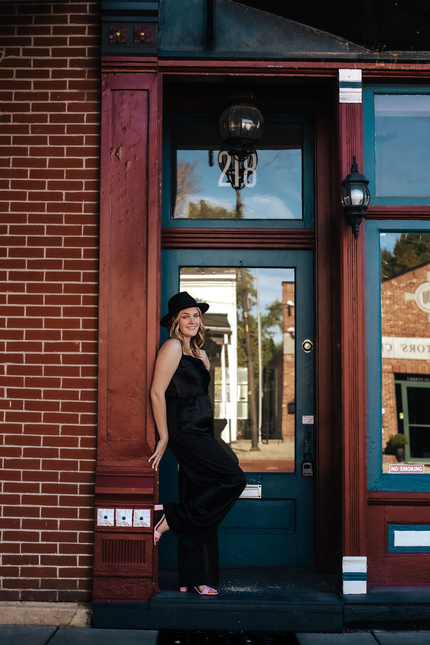 senior girl in an exterior doorway