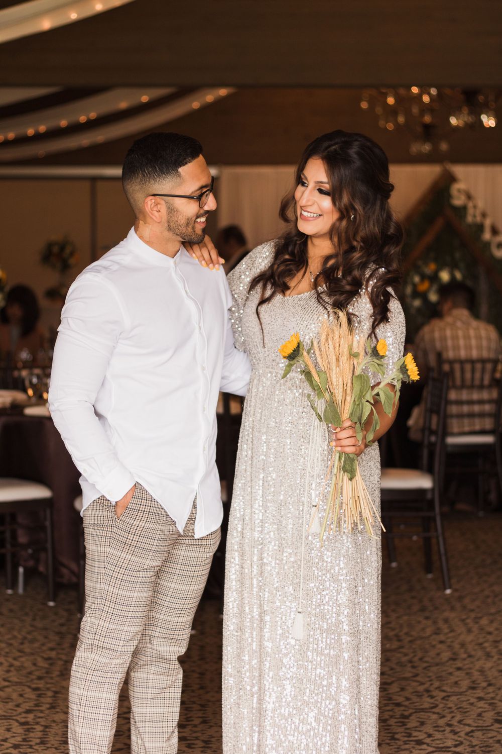 Engaged couple posing for an outdoor photoshoot before their wedding in Fresno, California