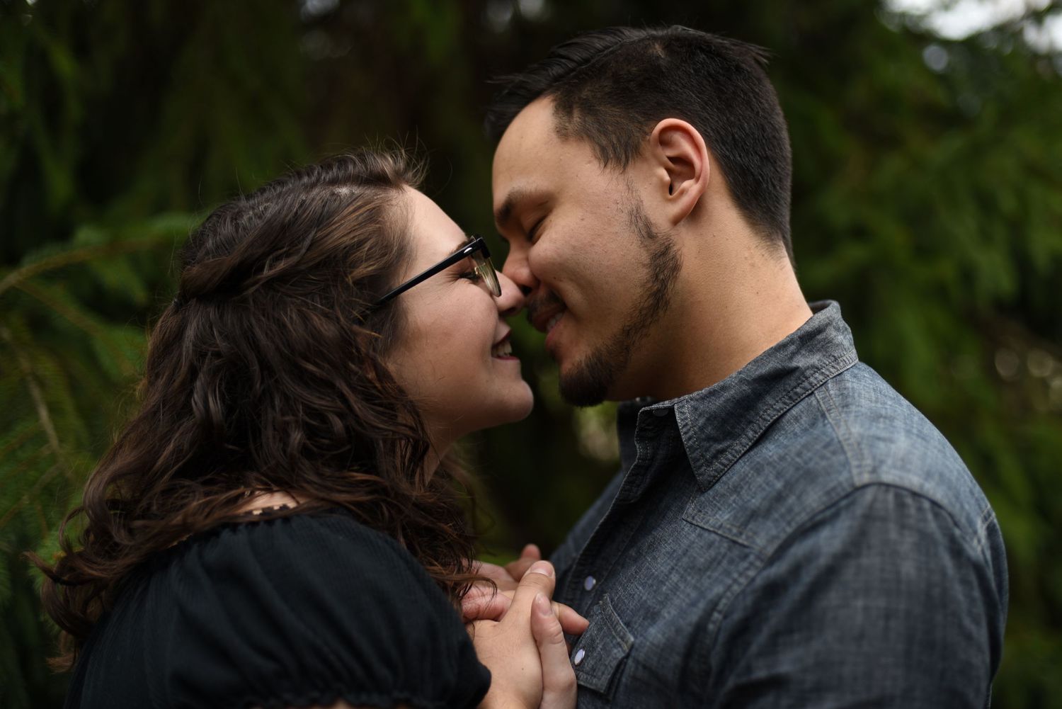 Couple kissing in the woods