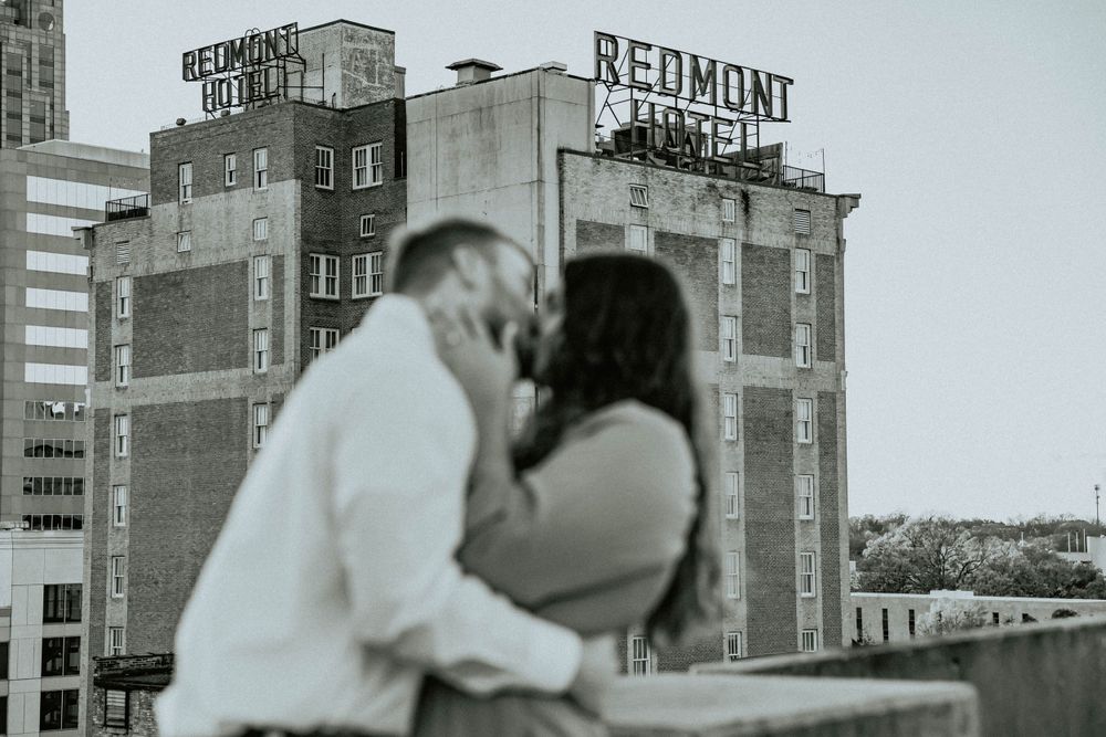 A black and white urban photoshoot with the Redmont Hotel sign in the background.