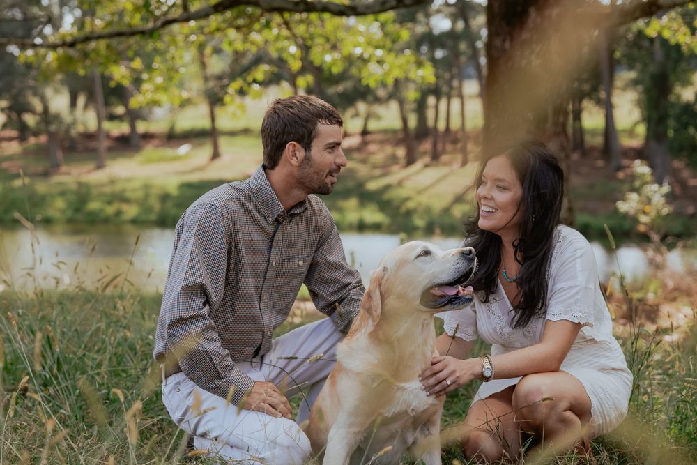 A casual outdoor photoshoot with a couple relaxing in nature.