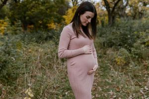 Fall pregnancy announcement at Massassauga Point in Prince Edward County, Ontario