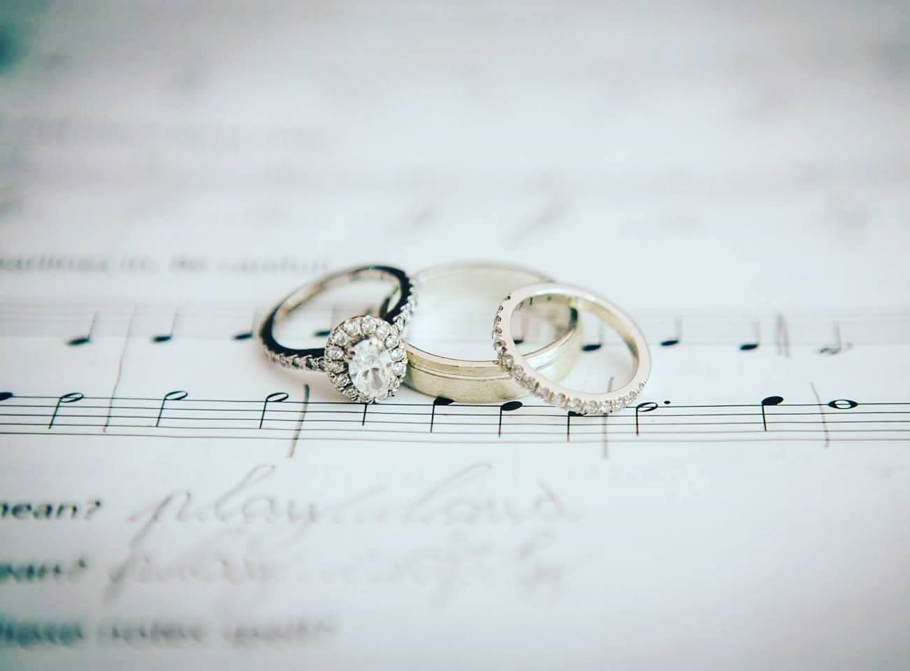 Sheet music notes on white paper with soft focus and dreamy lighting.