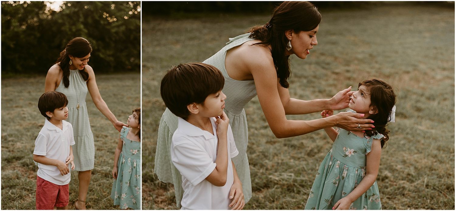 Playful interaction between family members during outdoor photo session at dusk.