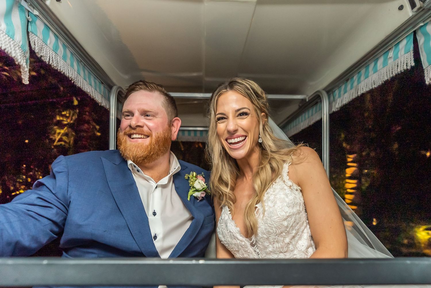 Wedding couple shares intimate moments in the back of a car during evening celebrations.