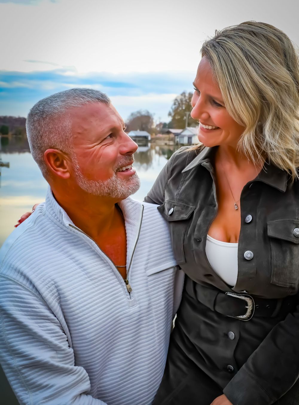 Couple sharing an intimate moment outdoors with natural lighting and warm expressions.