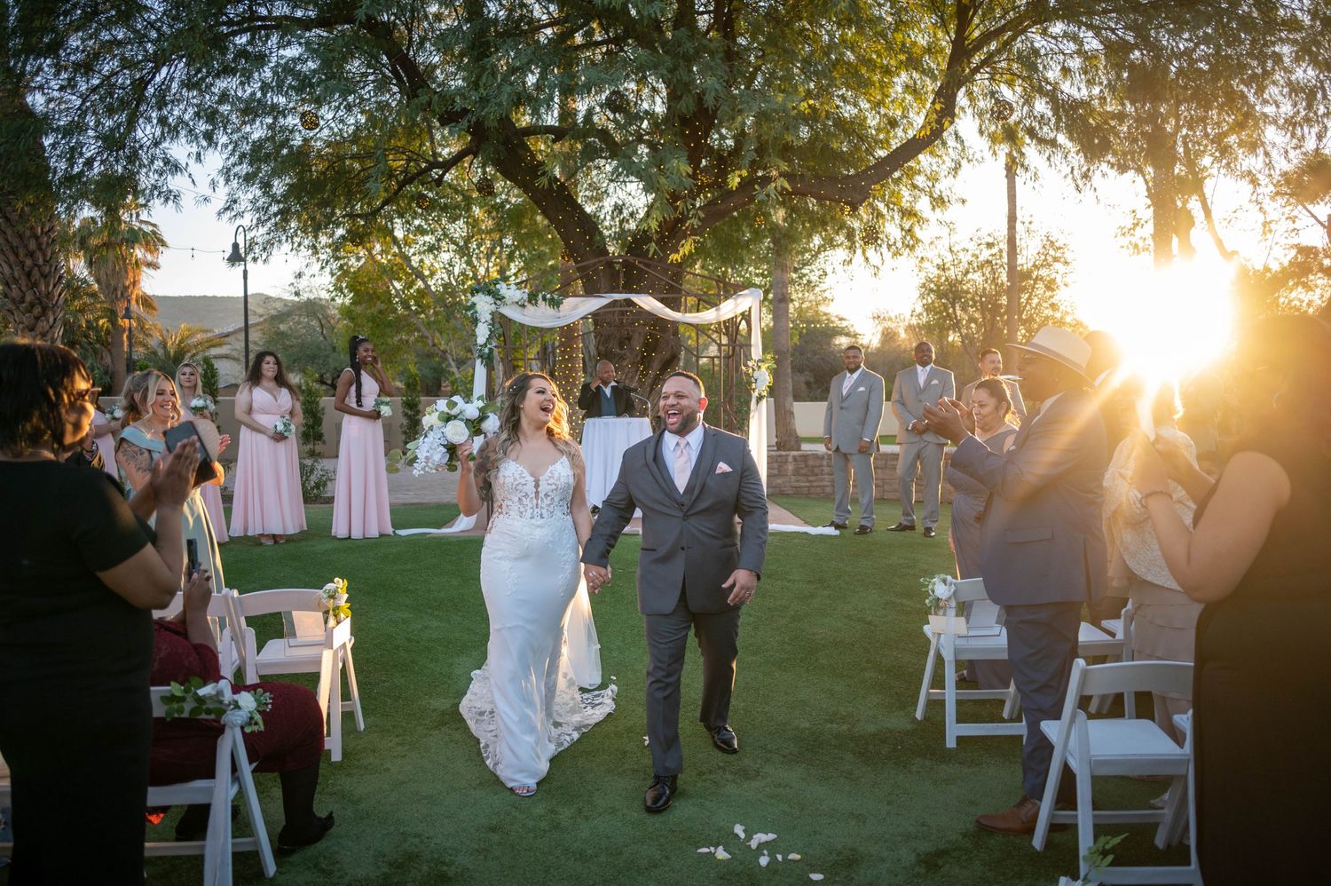All smiles after saying 'I do' at a Phoenix, AZ wedding, capturing the pure joy of a newlywed couple.