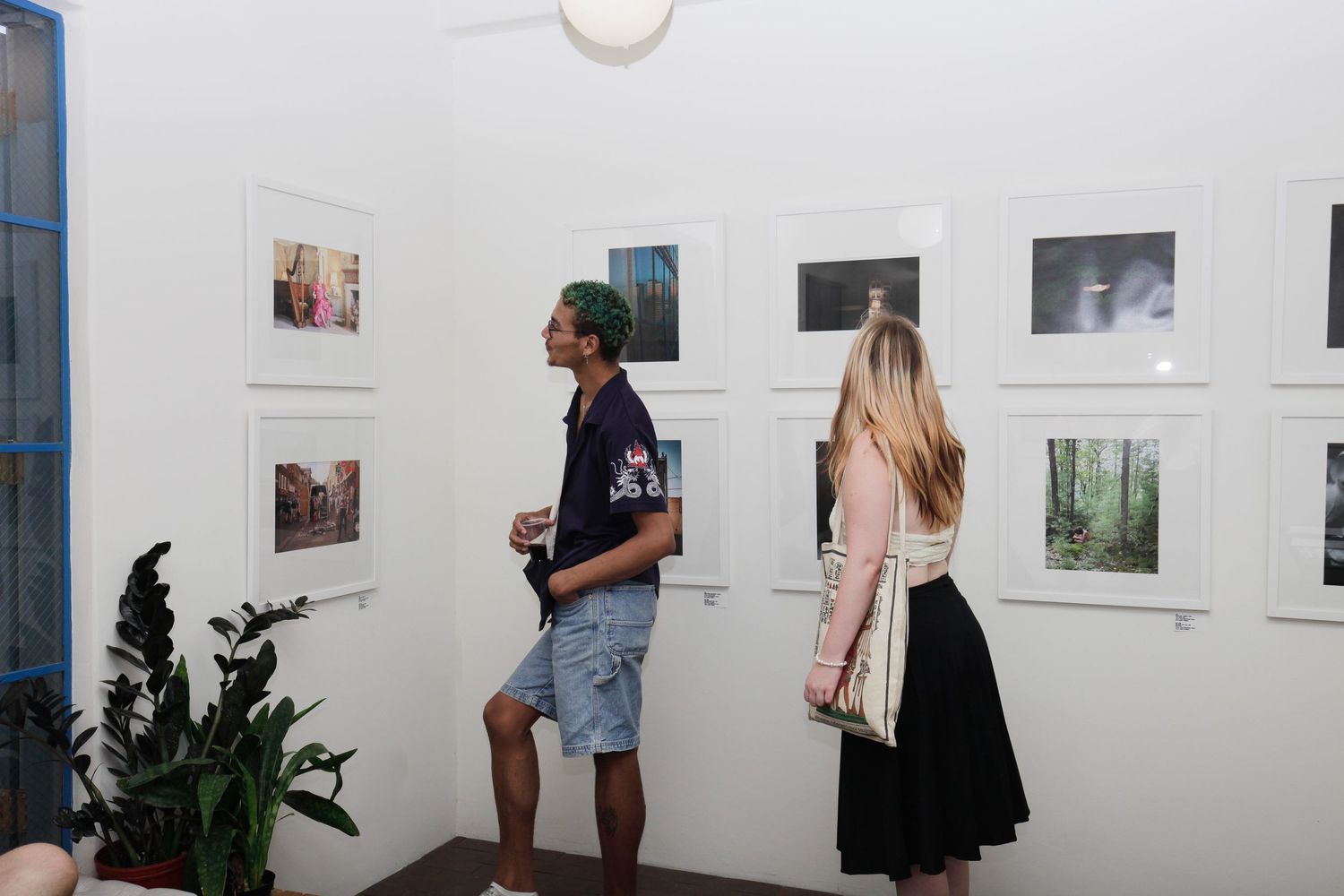 A man and a woman looking at art at an Exhibition in Arizona.