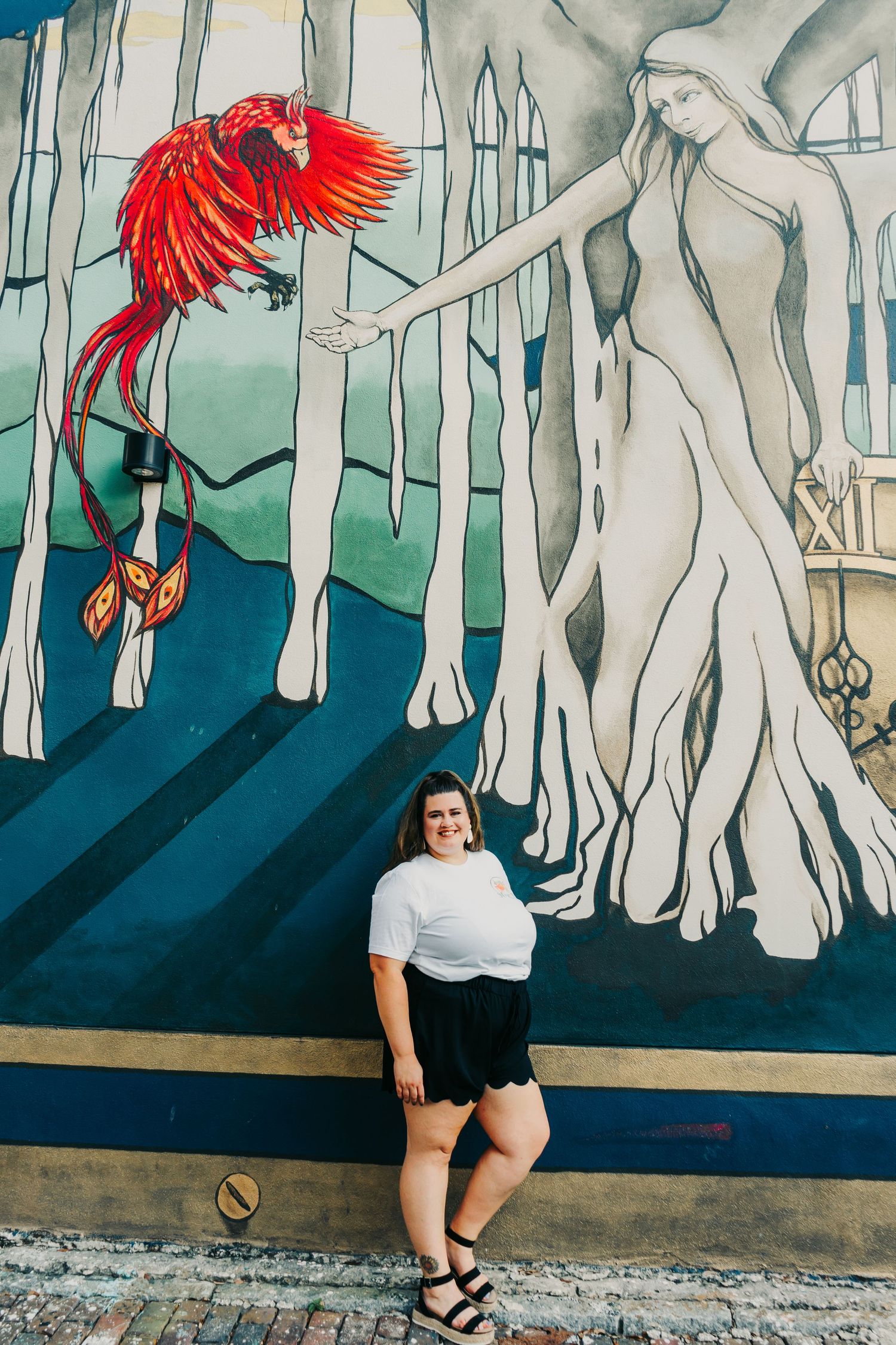 Outdoor Headshot Session in St. Pete, FL; Woman posing with mangrove mural