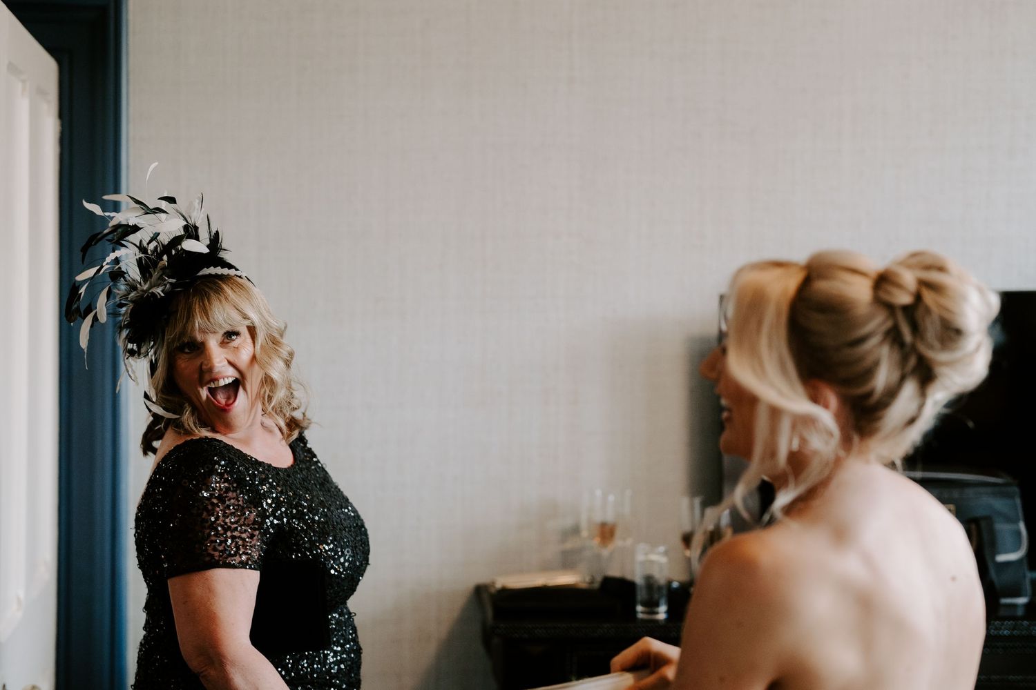 brides mum laughing with bridesmaid at the Randolph hotel in Oxford