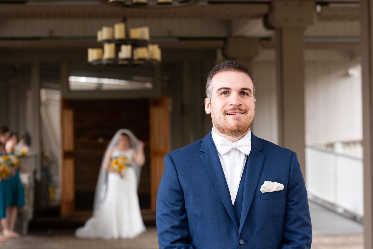 A groom bites his lip during wedding First Look at Heritage Hotel and Conference Center in Southbury, CT Leah Ramuglia
