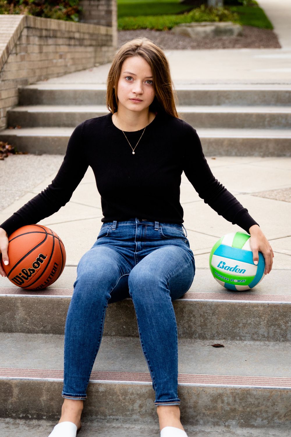 Senior Girl Sitting on Steps Volleyball and Basketball