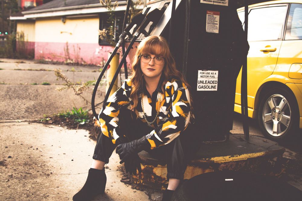 Senior Portrait Girl with Yellow Car in gas station