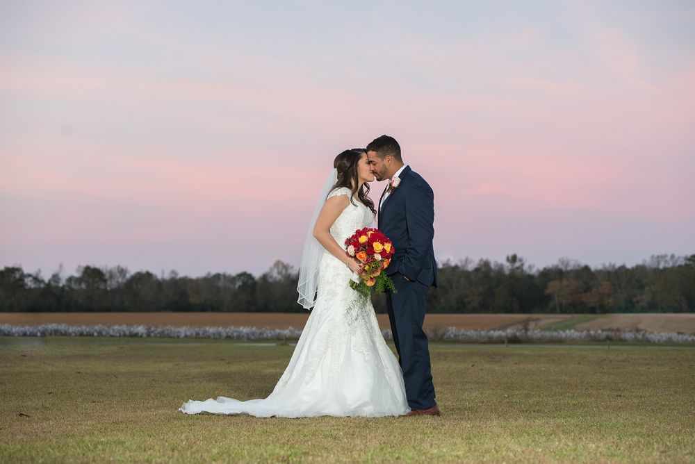 Sunset with bride and groom at kyles farm harrells nc