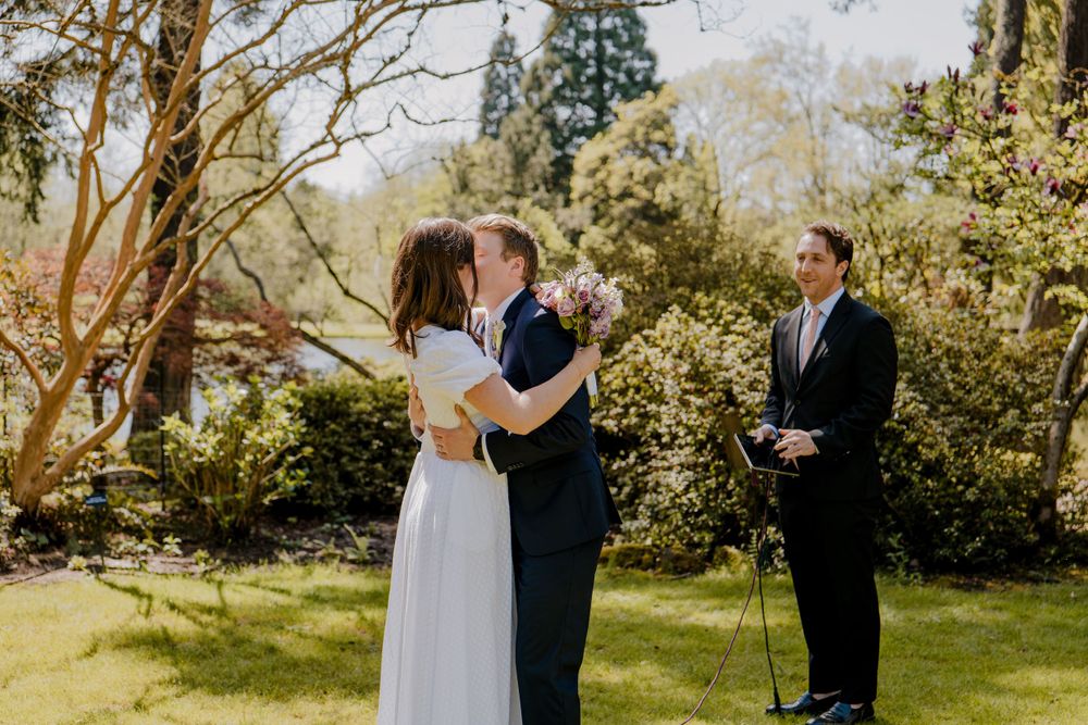 Bride and groom first kiss