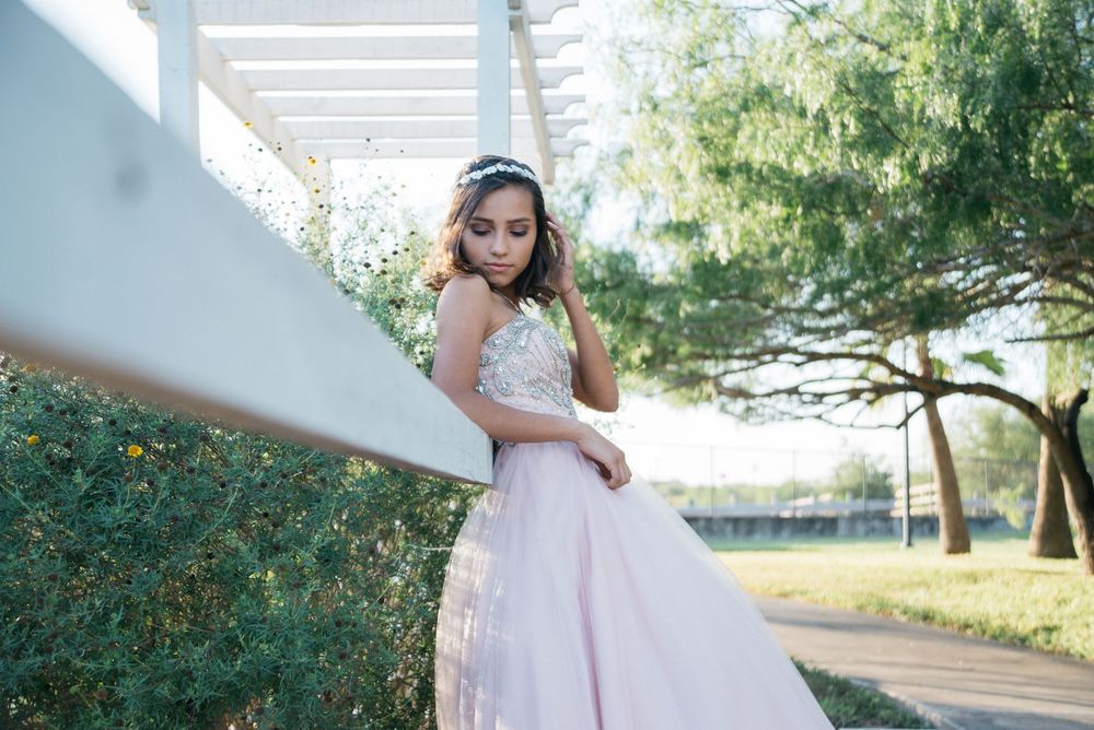 girl looking down to her shoulder. Hidalgo pump house. Hidalgo, texas. wedding photography