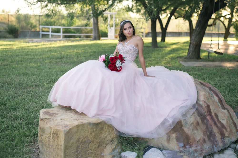 girl sitting on a rock for a photo. Hidalgo pump house. Hidalgo, texas. wedding photography