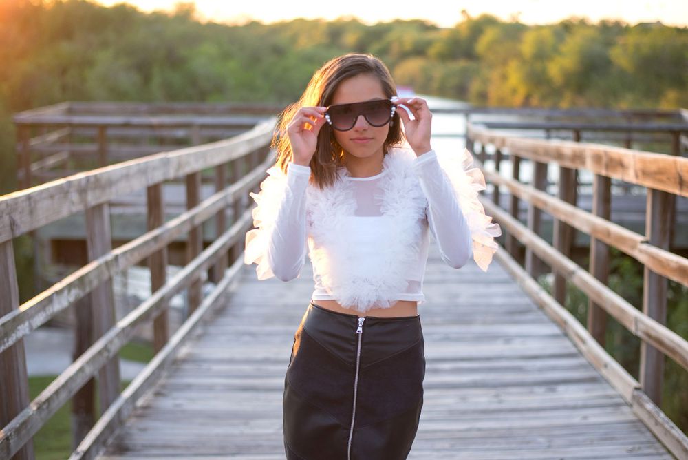 girl wearing sunglasses at the bridge. Hidalgo pump house. Hidalgo, texas. wedding photography