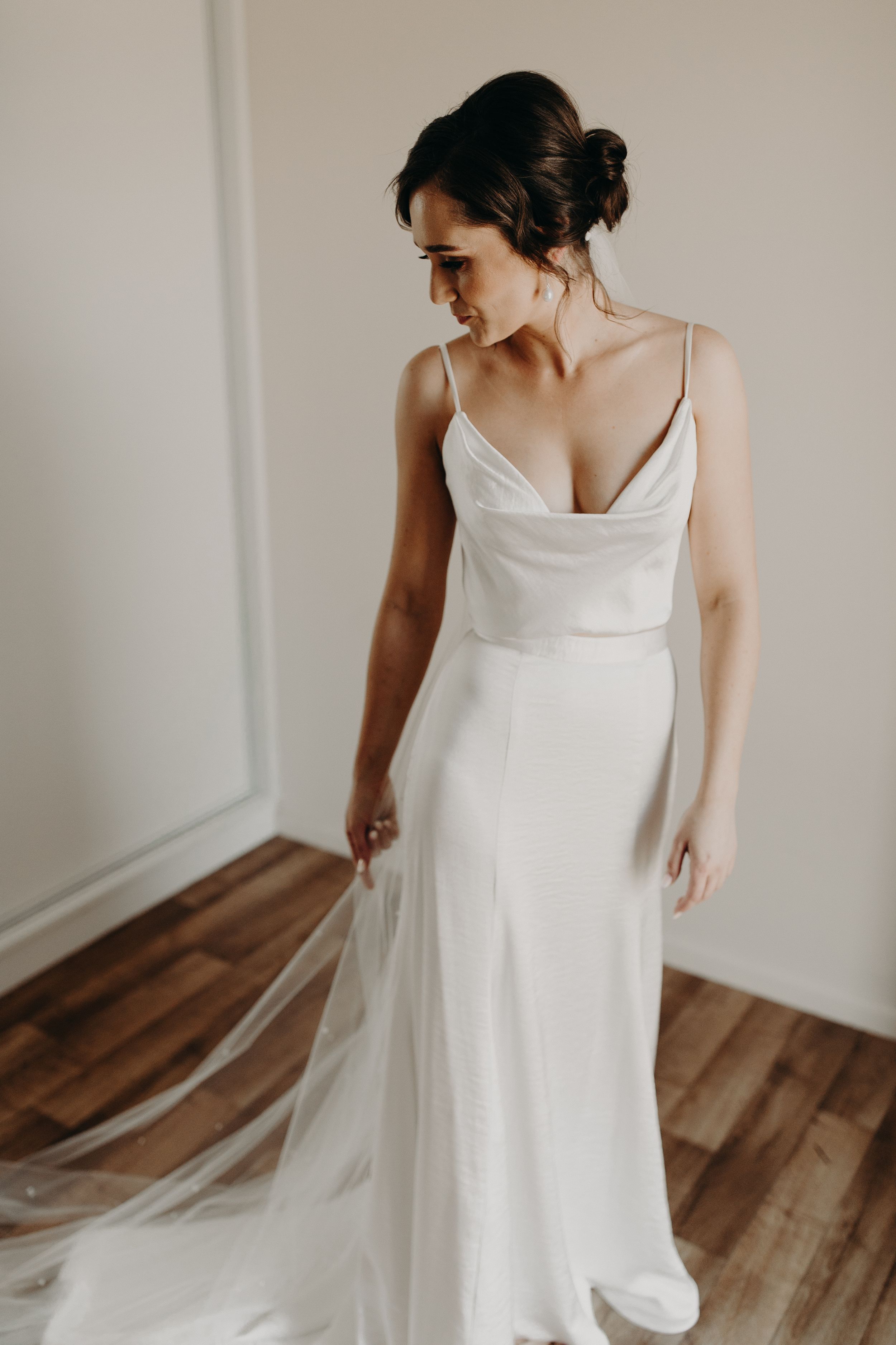Simple elegant wedding dress with spaghetti straps shown from multiple angles.