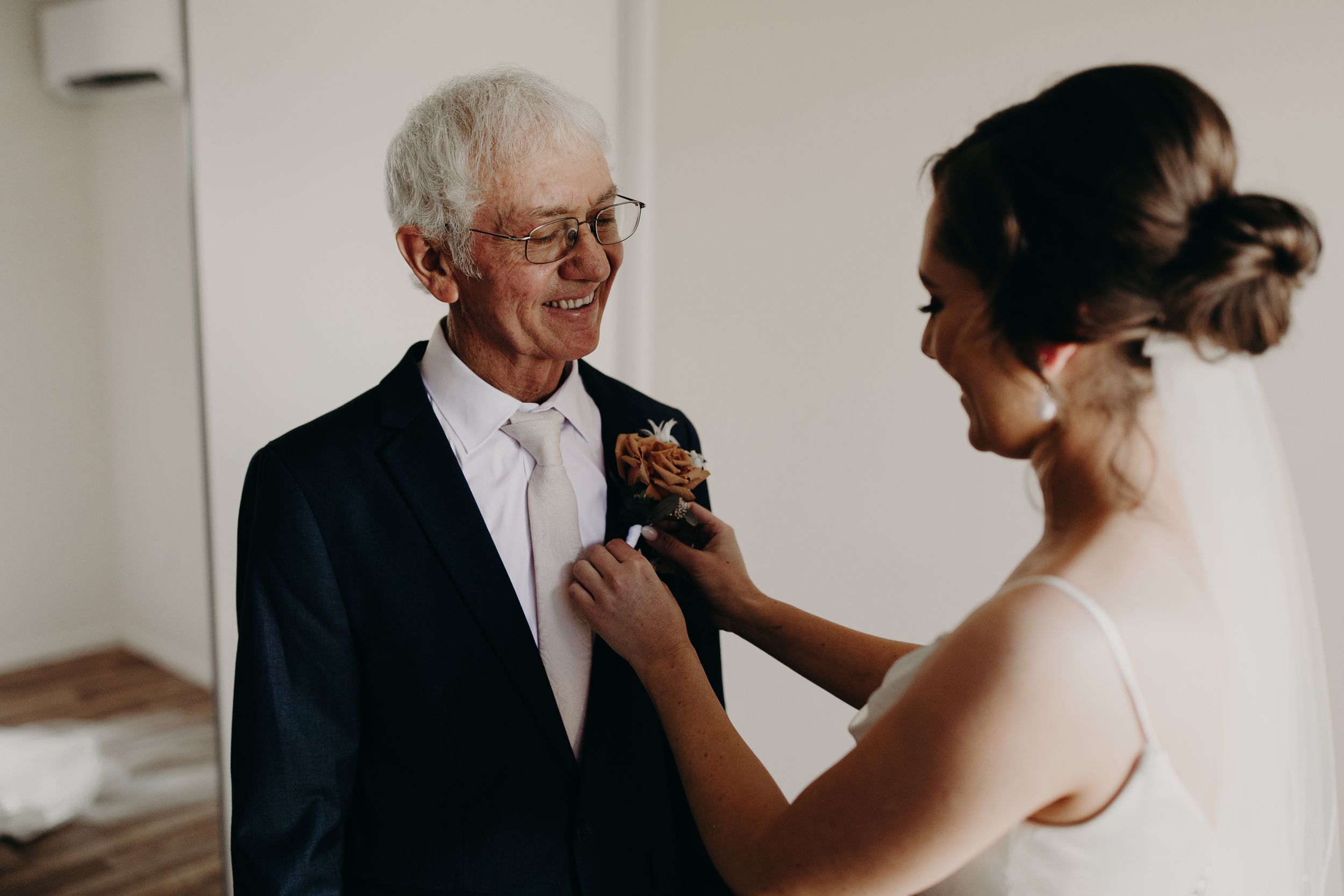 Emotional wedding day moments shared between formal-dressed participants.