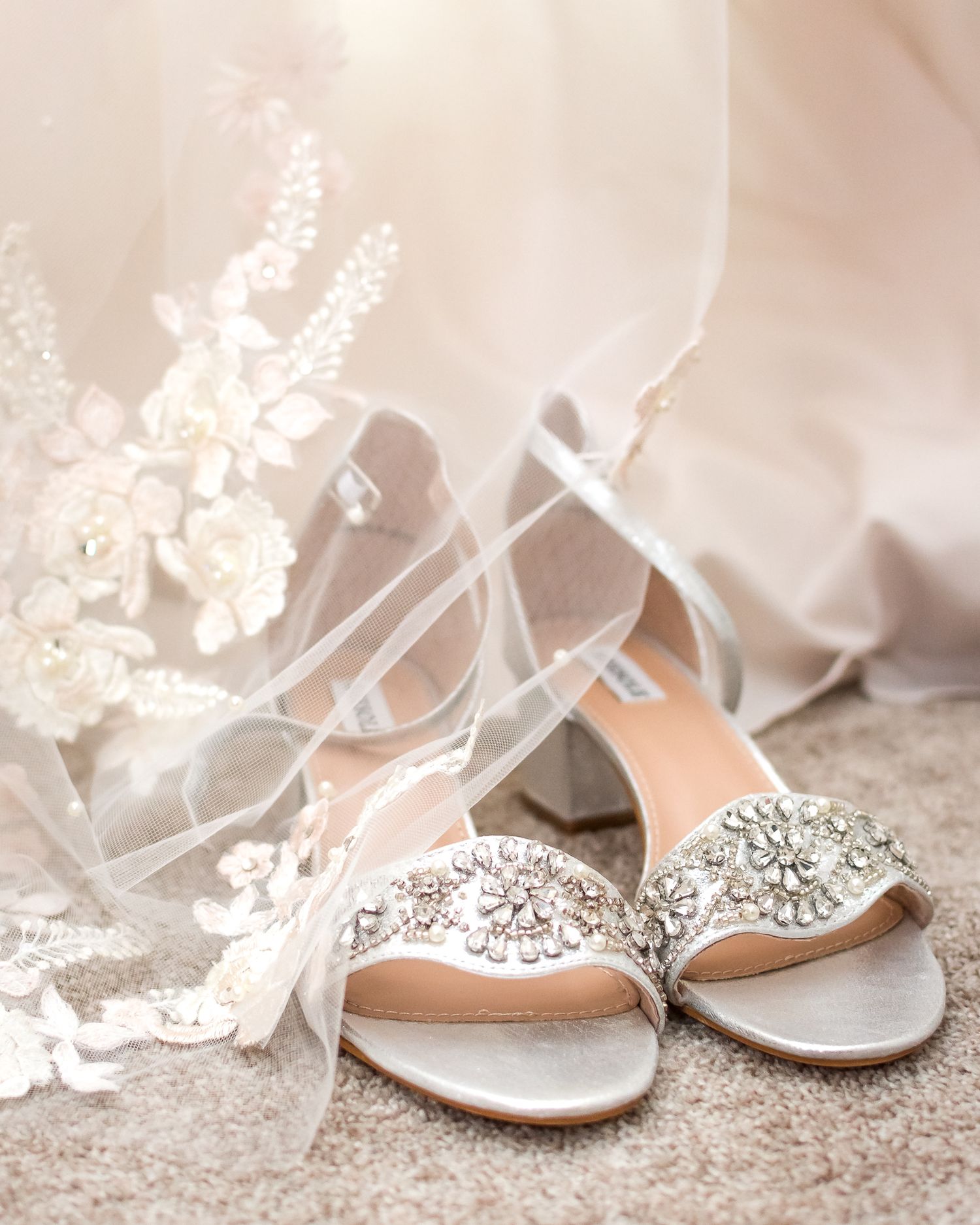 Gorgeous bridal shoes displayed with the bride's veil. Photo taken in Langley by Kari Mills Photography.
