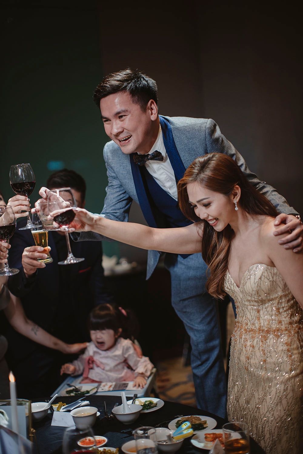 Husband and wife toasting in their dinner reception