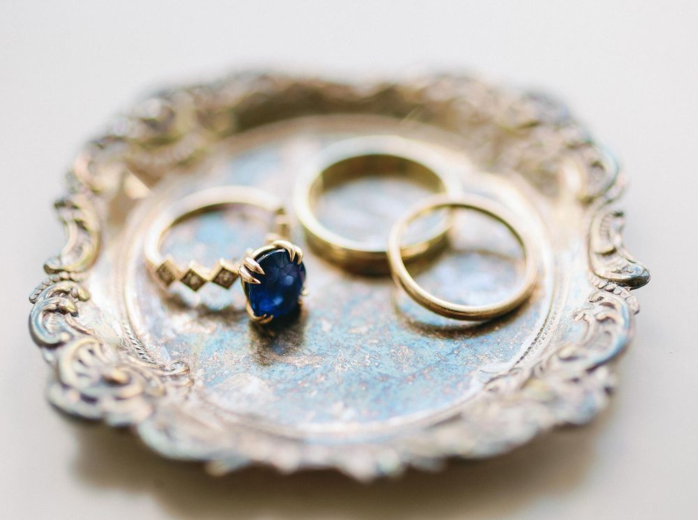 Pair of elegant wedding bands, one with a solitaire diamond, representing unity and devotion.
